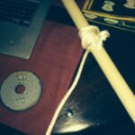 This is the home made fitness device using a dowel rod, a length of rope and a weight.