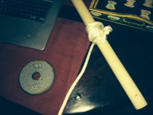 This is the home made fitness device using a dowel rod, a length of rope and a weight.